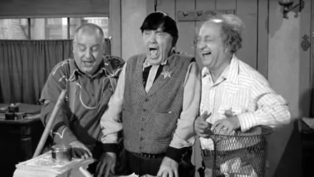 Black-and-white HD PC desktop wallpaper of a vintage TV slapstick trio — three men laughing and making faces in a classic stooges-style comedy scene.