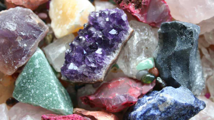 A close-up view of various colorful rocks and gemstones, showcasing natural textures and vibrant hues, making an engaging HD desktop wallpaper and background.