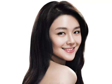 HD desktop wallpaper featuring a woman with long dark hair and a radiant smile, looking over her shoulder. The background is white, highlighting her face.