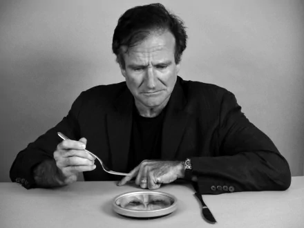 Black and white photo of a pensive man for an HD desktop wallpaper.