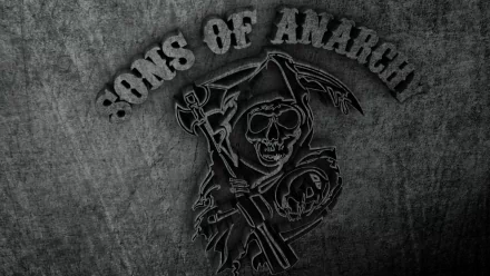 A stark HD wallpaper featuring the iconic logo from the TV show Sons Of Anarchy, showcasing a skull and crossed weapons against a dark, textured background.