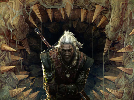 HD PC desktop wallpaper featuring Geralt of Rivia from the video game The Witcher 2: Assassins of Kings, emerging from a cavern framed by large animal jaws.
