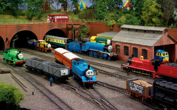 HD desktop wallpaper featuring Percy and Thomas the Tank Engine from the TV show Thomas & Friends, set in a vibrant railway yard with colorful trains and detailed scenery.