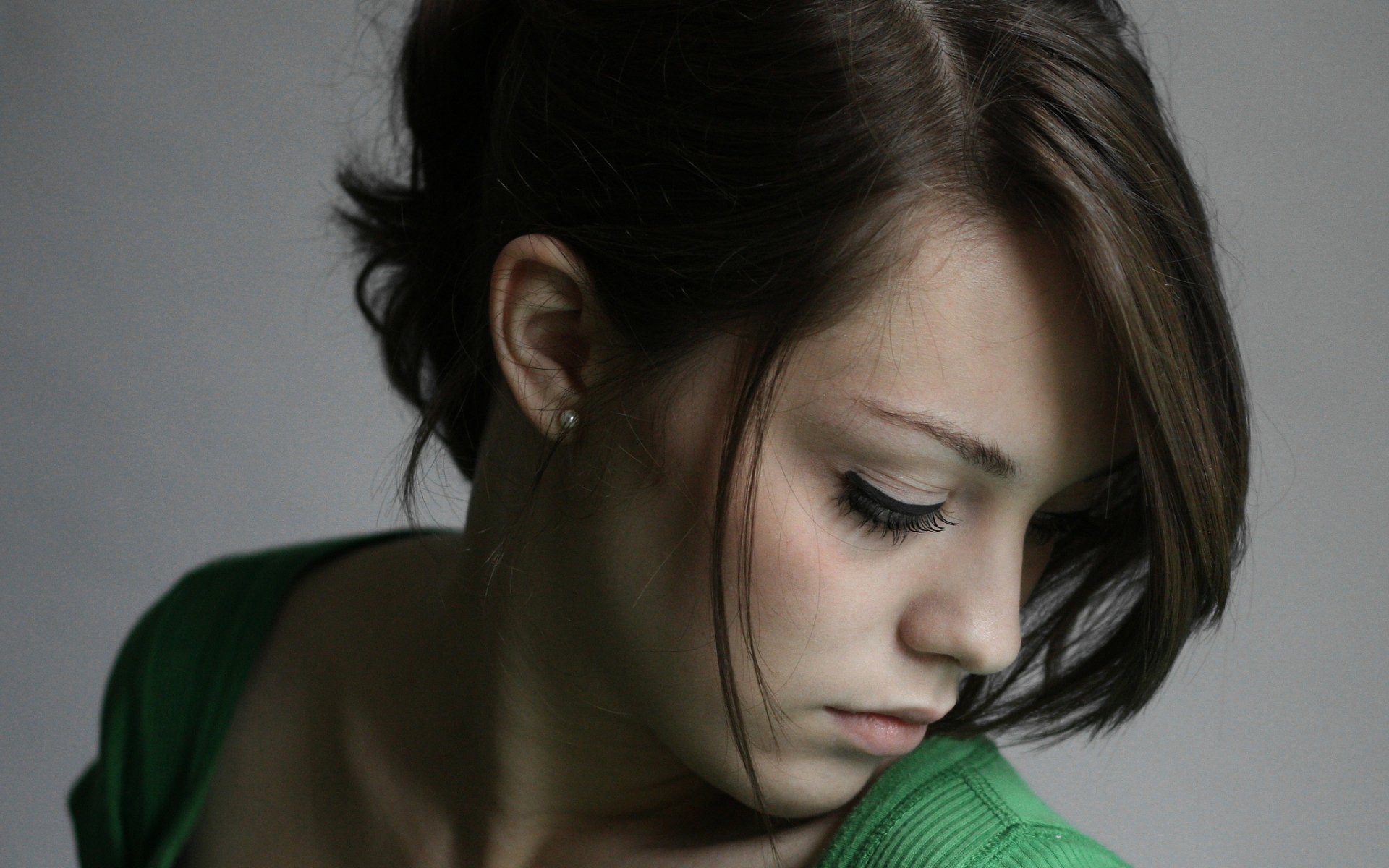 A woman named Imogen Dyer gazes downward, her expression thoughtful. This image serves as a striking HD desktop wallpaper and background.
