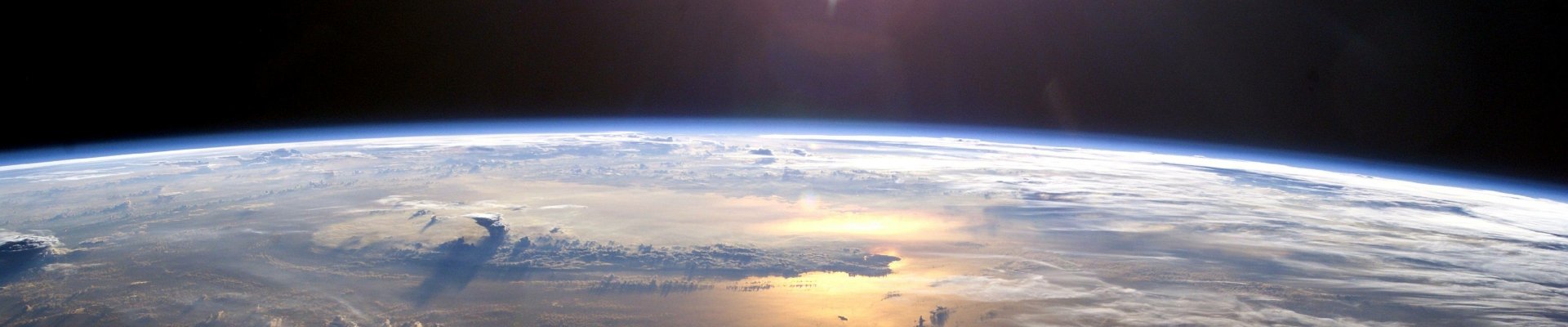 HD desktop wallpaper showing a stunning view of Earth from space, highlighting the planet's curvature, clouds, and the vastness of nature.