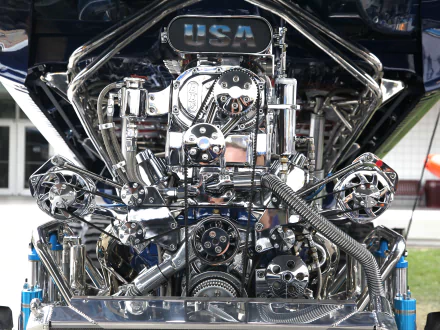 Close-up of a polished vehicle engine showcasing intricate chrome details, captured in 4K Ultra HD for a striking PC desktop wallpaper and background.