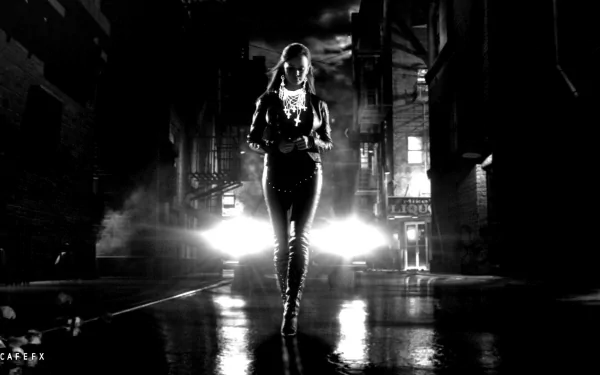 HD PC desktop wallpaper of a dark, moody Sin City movie scene featuring a solitary figure walking down a rain-soaked street with bright headlights behind.