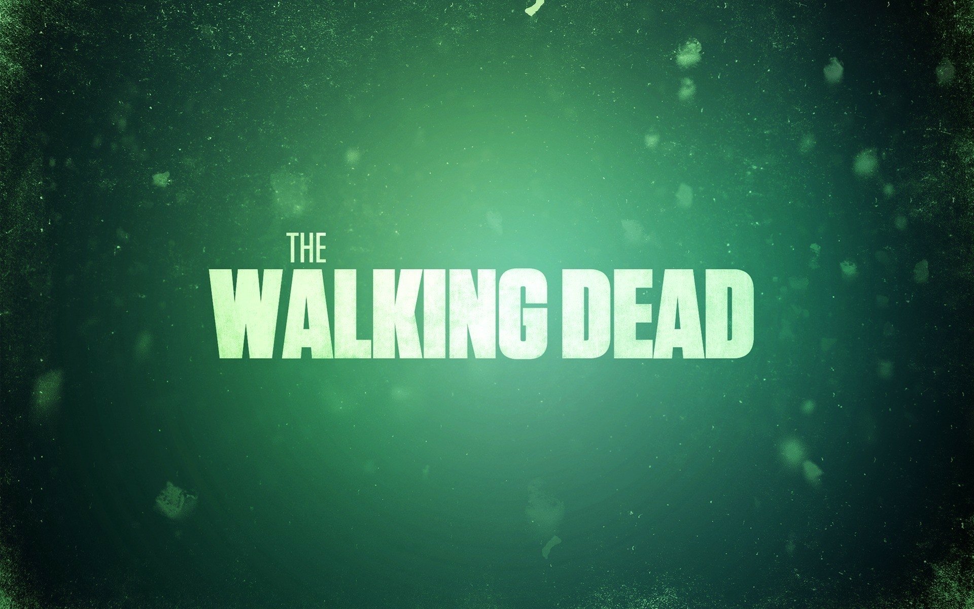 Green-tinted HD desktop wallpaper featuring the text The Walking Dead against a dark background, associated with the TV show.