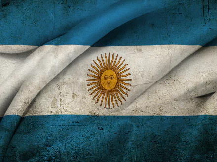 HD PC desktop wallpaper: textured, wrinkled flag of Argentina with blue-white-blue bands and a golden Sun of May centered, worn-grunge appearance.