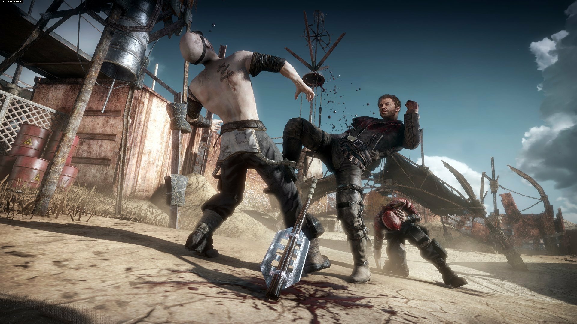 HD PC desktop wallpaper featuring intense combat between characters in a post-apocalyptic Mad Max video game setting.