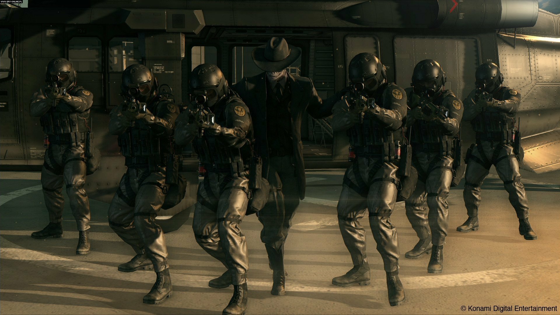 HD PC desktop wallpaper featuring a tactical squad from the video game Metal Gear Solid V: The Phantom Pain in a dimly lit, intense standoff scene.