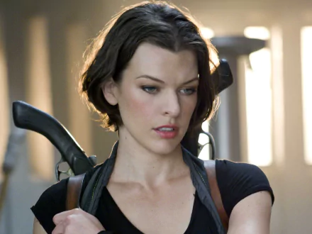 Milla Jovovich in a scene from Resident Evil: Afterlife, showcasing her character's determination. This HD wallpaper captures the film's intense atmosphere.