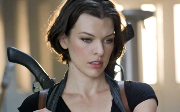 Milla Jovovich in a scene from Resident Evil: Afterlife, showcasing her character's determination. This HD wallpaper captures the film's intense atmosphere.