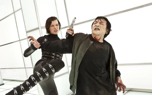 Milla Jovovich in a dynamic scene from *Resident Evil: Retribution*, showcasing intense action against a male opponent in a futuristic setting. HD desktop wallpaper.