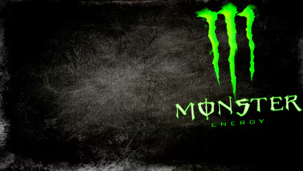 HD PC desktop wallpaper featuring the bright green Monster Energy logo on a textured dark background, showcasing a bold, man-made design.
