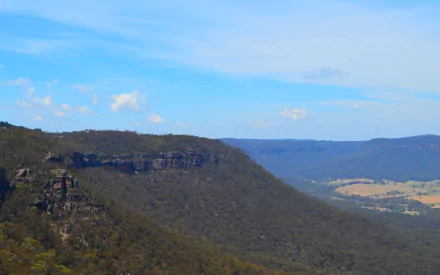 HD PC desktop wallpaper/background: Blue Mountains, Australia — tree-dotted mountain ridgeline and sunlit valley under a clear blue sky.