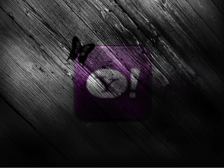 HD PC desktop wallpaper featuring a dark wooden background with a purple Yahoo logo and a black butterfly, blending technology and nature themes.