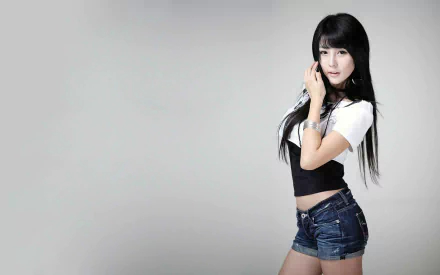 HD desktop wallpaper featuring a Korean woman, Lee Ji Woo, in casual attire with a plain light background.