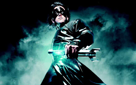 A dramatic HD wallpaper of the movie Krrish 3, featuring a superhero posed heroically with a glowing weapon, set against a misty, dark background.