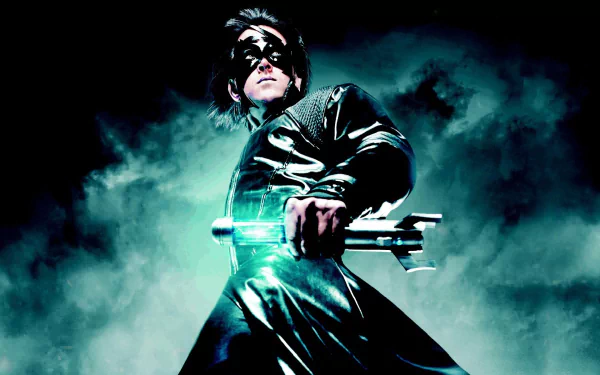 A dramatic HD wallpaper of the movie Krrish 3, featuring a superhero posed heroically with a glowing weapon, set against a misty, dark background.