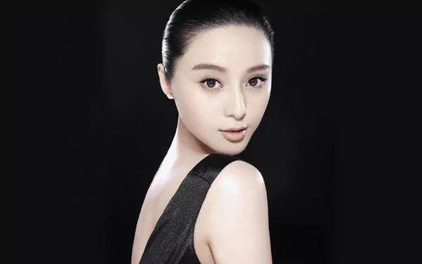 HD desktop wallpaper featuring Chinese celebrity Fan Bingbing, known as a singer and actress, against a sleek black background.