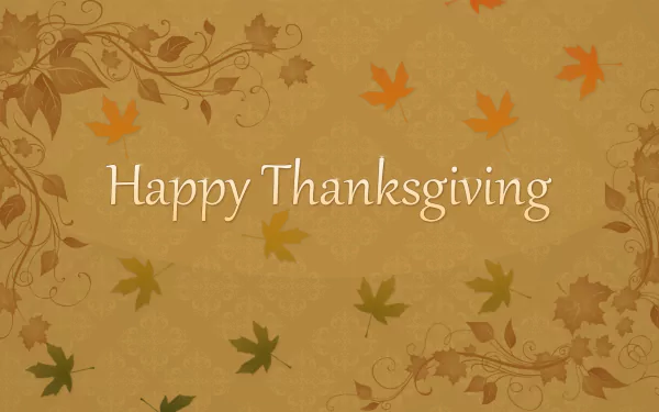 HD PC desktop wallpaper featuring Happy Thanksgiving text with autumn leaves and decorative floral accents, celebrating the Thanksgiving holiday.