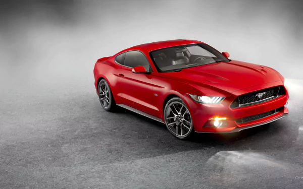 A striking red 2015 Ford Mustang GT stands confidently against a misty backdrop, showcasing its sleek design in this HD desktop wallpaper.