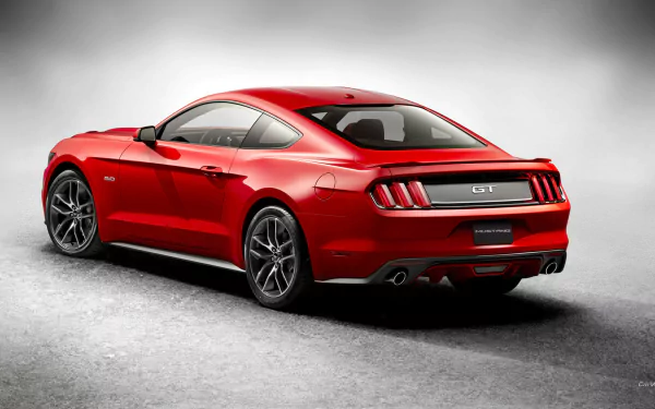 A sleek red 2015 Ford Mustang GT showcased from the rear, set against a soft grey background, creating a striking HD desktop wallpaper.