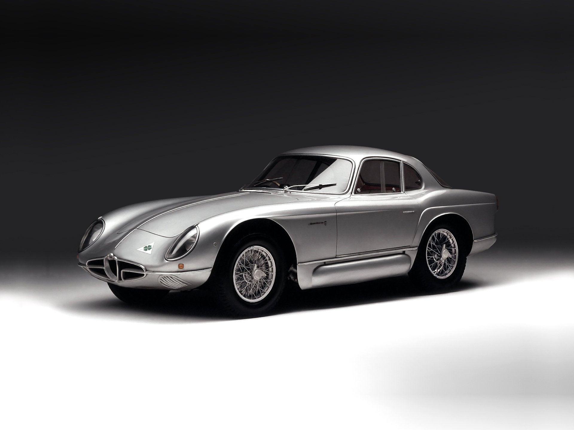 Silver Alfa Romeo 2000 Sportiva classic vehicle on a smooth gray gradient background — HD PC desktop wallpaper.