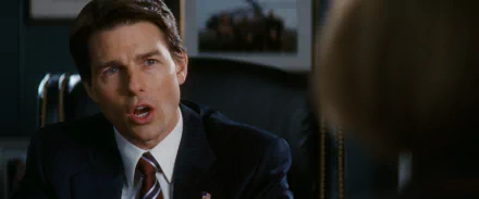 Cinematic close-up of a man in a suit mid-speech in an office; still from the movie Lions for Lambs, formatted as an HD PC desktop wallpaper/background.
