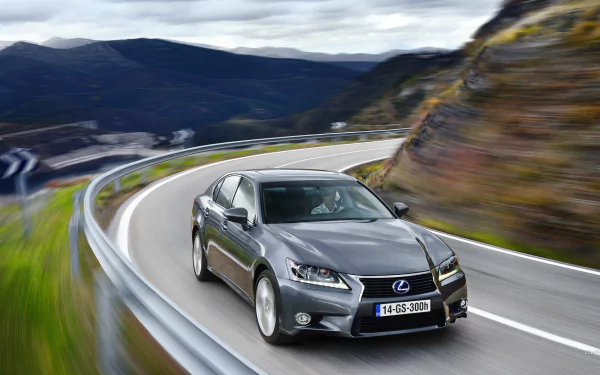 HD PC desktop wallpaper featuring a sleek Lexus GS 300h navigating a winding mountain road, showcasing the elegant design of the Lexus GS vehicle.