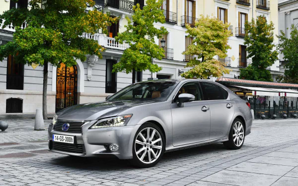 HD PC desktop wallpaper featuring a silver Lexus GS 300h parked on a city street, showcasing the sleek design of the Lexus GS hybrid vehicle.