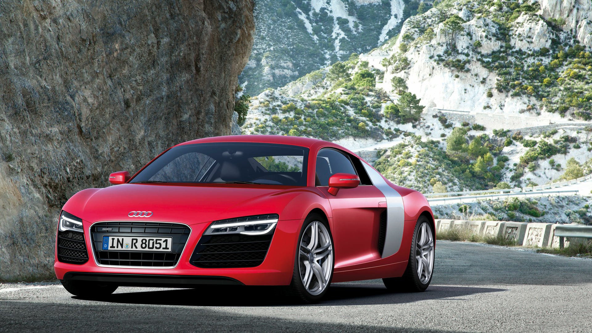 A red Audi R8 supercar parked on a mountain road, captured in high-definition for a PC desktop wallpaper and background.