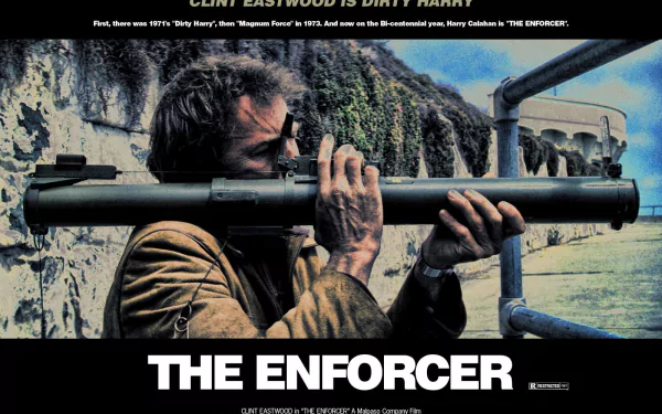HD desktop wallpaper — gritty movie poster of an iconic cop aiming a rocket launcher from a seaside railing; bold title The Enforcer with 1976 film credits.
