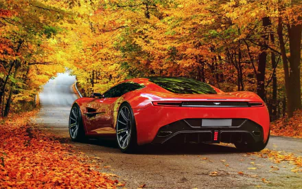 A stunning Aston Martin DBC is parked on a winding road surrounded by vibrant autumn leaves, creating a striking contrast in this HD desktop wallpaper.