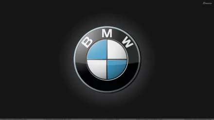 A sleek HD PC desktop wallpaper featuring the iconic BMW logo, showcasing its distinctive blue and white design against a dark background.