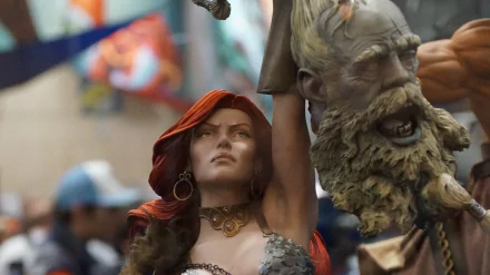 Comic illustration of Red Sonja with flowing red hair, raising a severed bearded head in triumph — bold warrior pose, detailed 2K Quad HD PC desktop wallpaper and background.