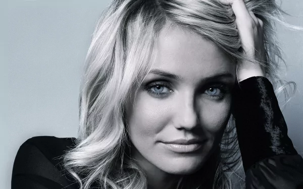 Close-up HD desktop wallpaper of celebrity Cameron Diaz with blonde hair and a subtle smile against a soft gray background.