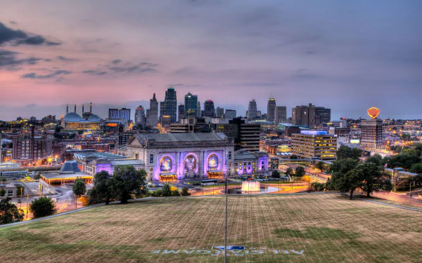 Kansas City skyline at dusk with prominent man-made buildings and Union Station illuminated, captured as an HD desktop wallpaper background.