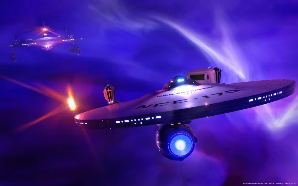HD desktop wallpaper of a Star Trek starship in a vivid cosmic background with a smaller spacecraft approaching from the distance.