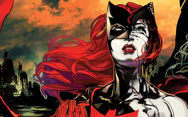 Comic Batwoman HD PC desktop wallpaper and background: red-haired masked heroine with streaked makeup, crimson cape and city skyline against a fiery orange sky.