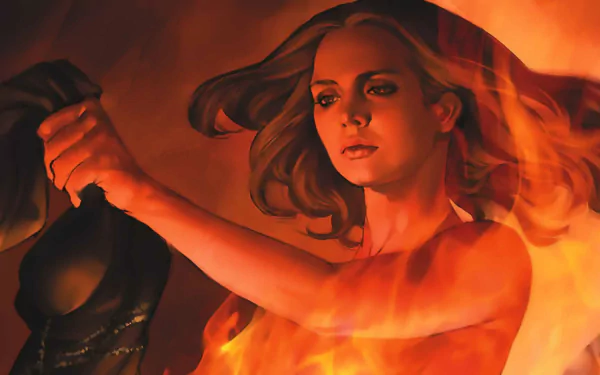 Comic-style HD PC desktop wallpaper of Buffy the Vampire Slayer bathed in flames, holding a dark mask or cloth with a resolute expression against a red-orange background.