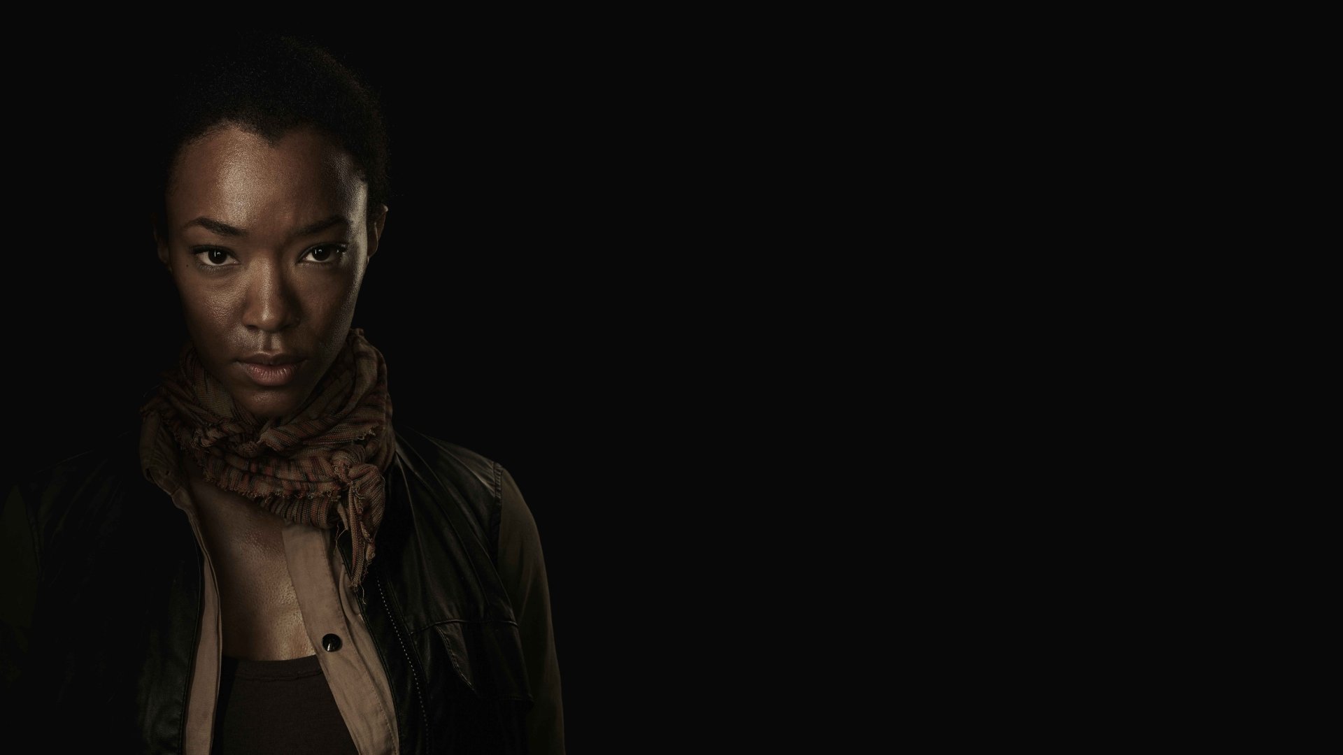 High-resolution 8K Ultra HD desktop wallpaper featuring a character from the TV show The Walking Dead against a dark background.