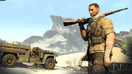 Sniper Elite III HD PC desktop wallpaper: battle-worn sniper holding a rifle by a jeep in a sunlit desert with a rocky outcrop.