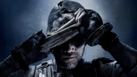 HD PC desktop wallpaper featuring a soldier from the video game Call of Duty: Ghosts pulling down his mask in a dark, intense setting.