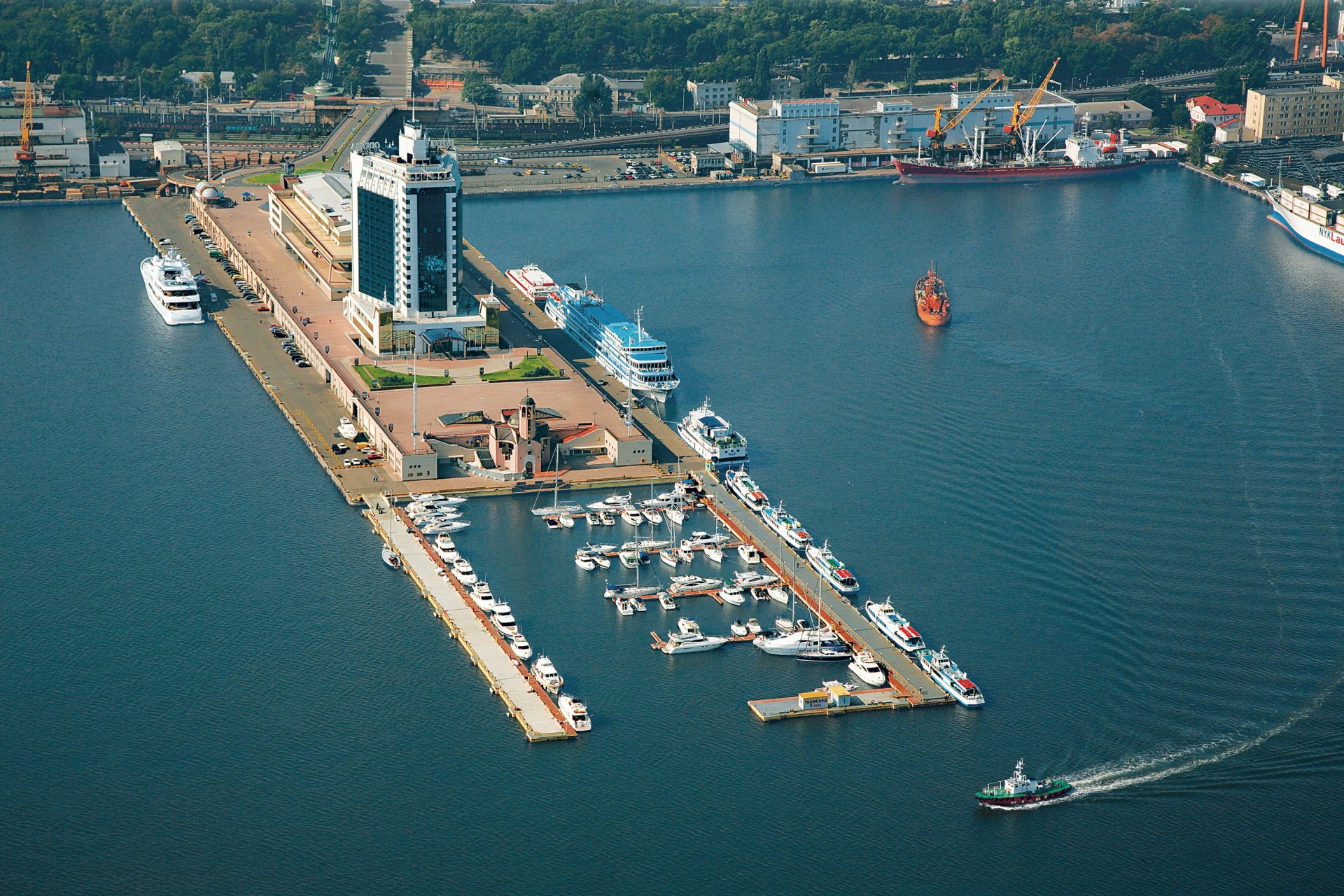 Aerial view of a man-made harbor in Odessa with docks, yachts, buildings, and ships, captured in HD for a PC desktop wallpaper and background.