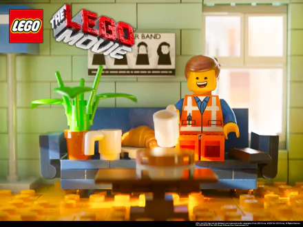 HD desktop wallpaper featuring the character Emmet lounging on a couch with The Lego Movie logo in the background.