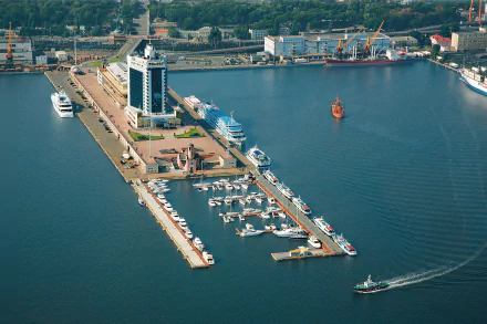 Aerial view of a man-made harbor in Odessa with docks, yachts, buildings, and ships, captured in HD for a PC desktop wallpaper and background.
