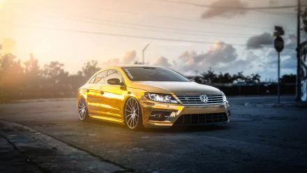 A sleek Volkswagen CC parked on an empty road during sunset, captured in stunning 4K Ultra HD detail for a PC desktop wallpaper.