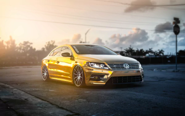 A sleek Volkswagen CC parked on an empty road during sunset, captured in stunning 4K Ultra HD detail for a PC desktop wallpaper.